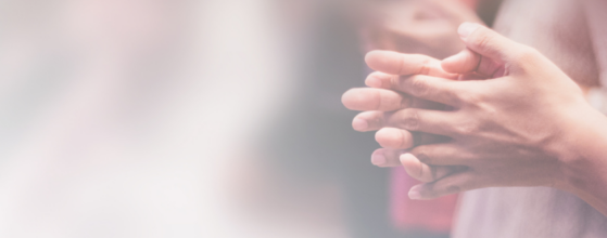 Woman's hands clasped together